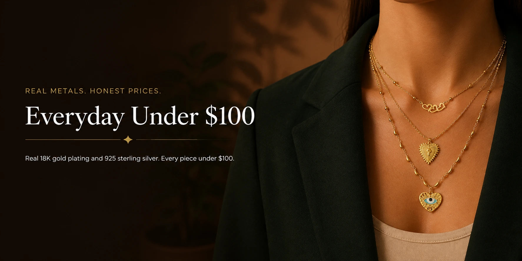 Layered 18K gold-plated chain necklaces with a heart-shaped evil eye pendant — everyday jewellery under $100