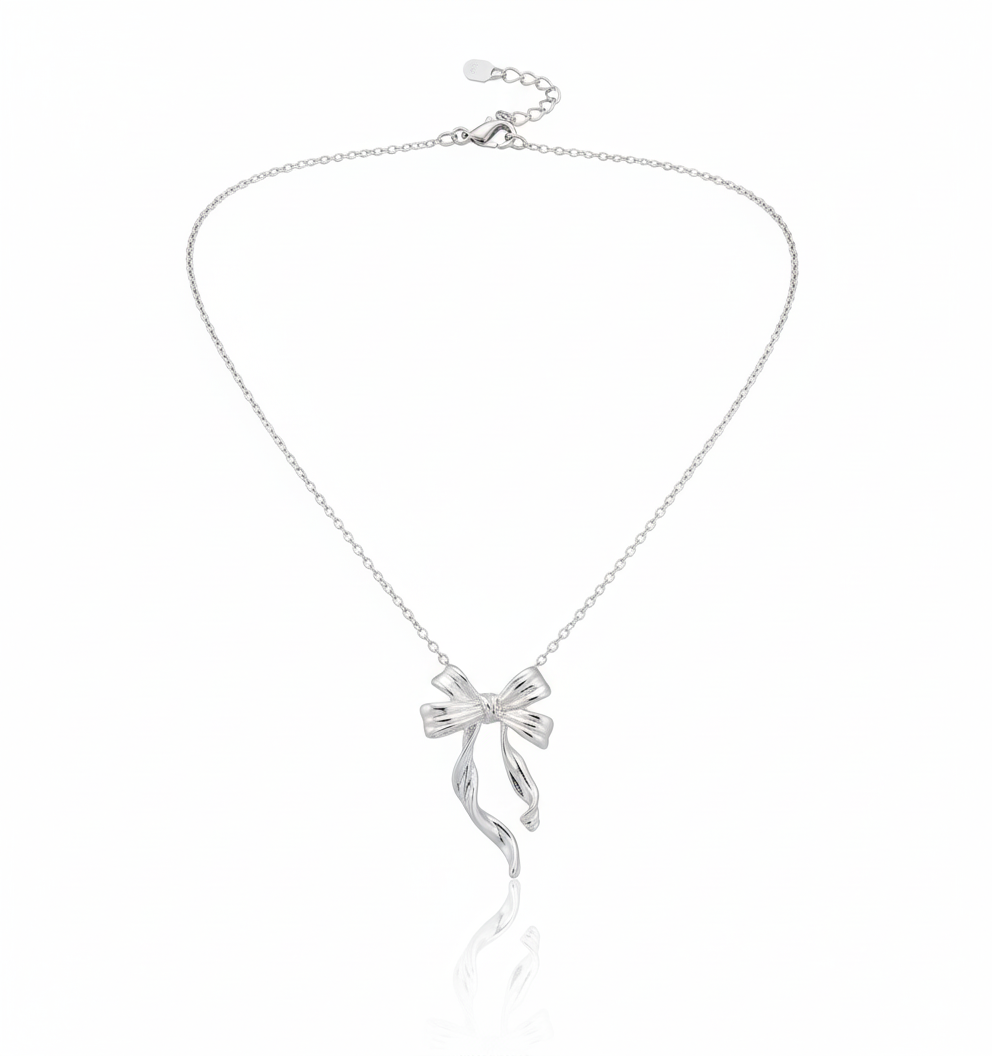 Amoura Bow Necklace in 925 sterling silver with rhodium-plated finish and bow knot pendant by Dione Canada