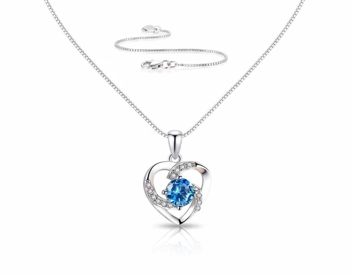 Azure Heart Necklace in S925 sterling silver with platinum-plated finish, sky-blue gemstone and white crystall accents by Dione Canada