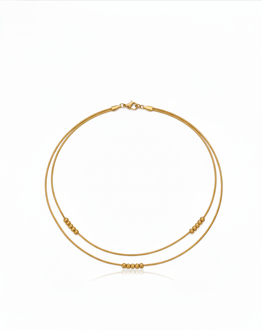 Beadline Duo Necklace in 18K PVD gold-plated 304 stainless steel with dual-layer snake chain and polished gold bead accents by Dione Canada