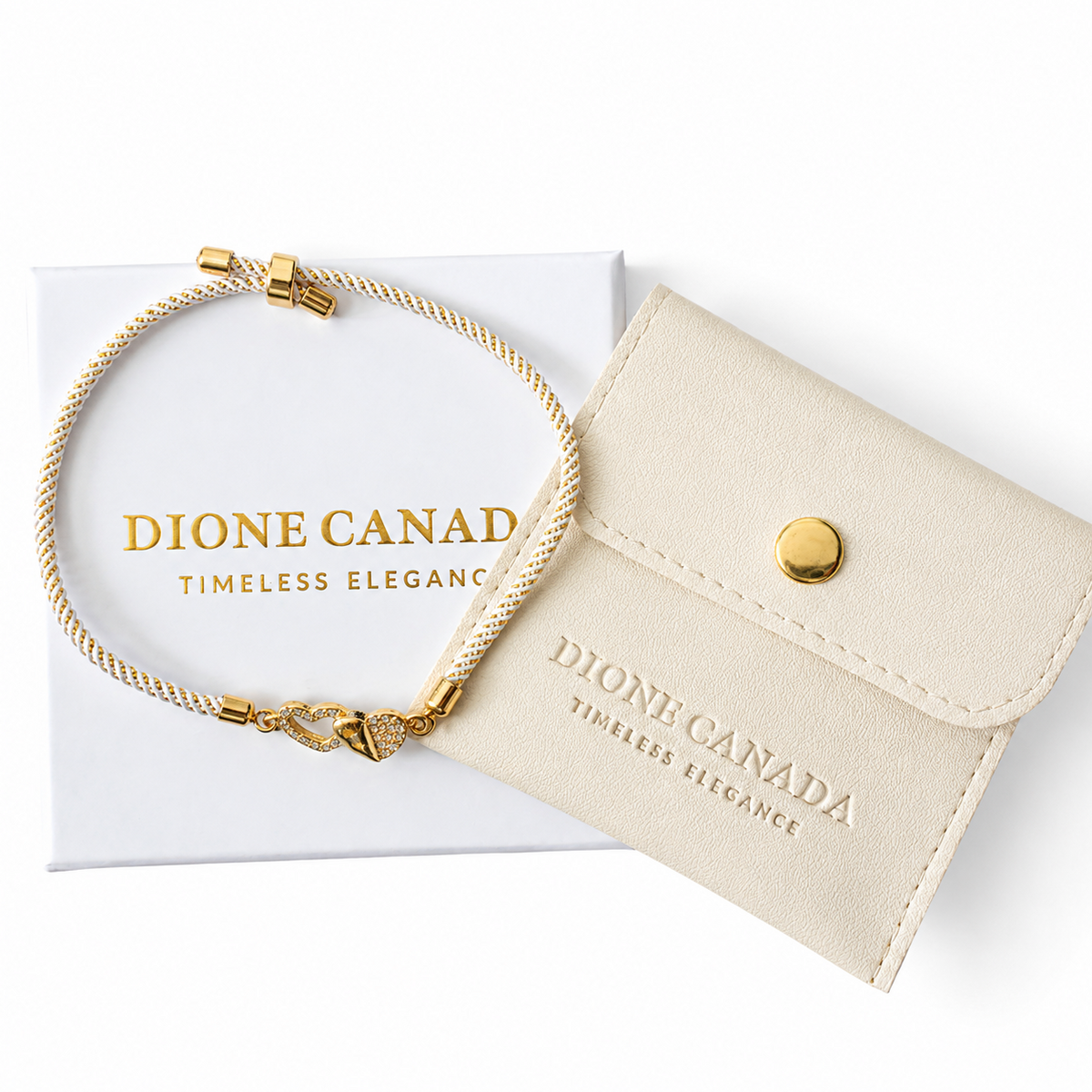 A cream-colored leather wallet with gold hardware and a matching gold rope bracelet, displayed on top of a white Dioneo Canada gift box.