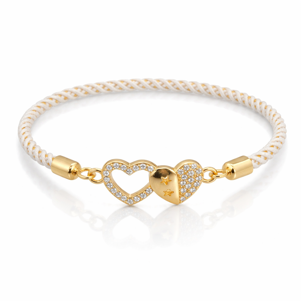 Gold heart-shaped bracelet with white cord on a white background