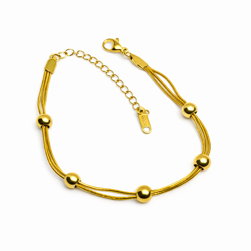 Dione Canada gold multi strand beaded bracelet with adjustable chain closure
