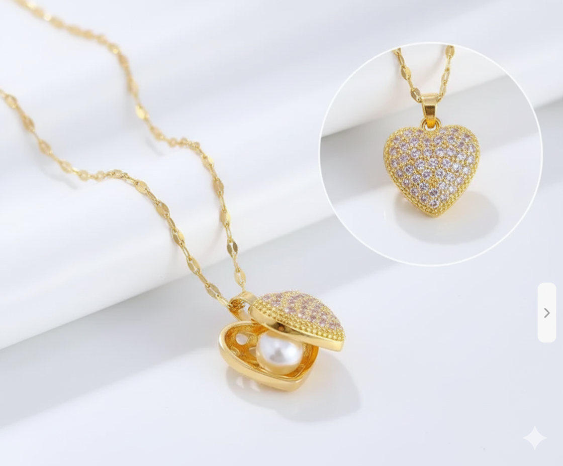 “Dione Canada gold heart locket necklace featuring a shimmering crystal-covered heart that opens to reveal a pearl centerpiece, shown in a clean luxury studio close-up.