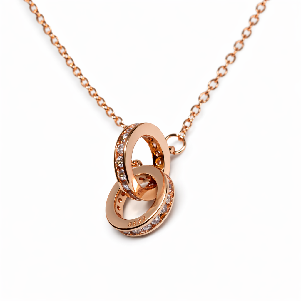 Dione Canada rose gold interlocking rings necklace with crystal accents on a delicate chain
