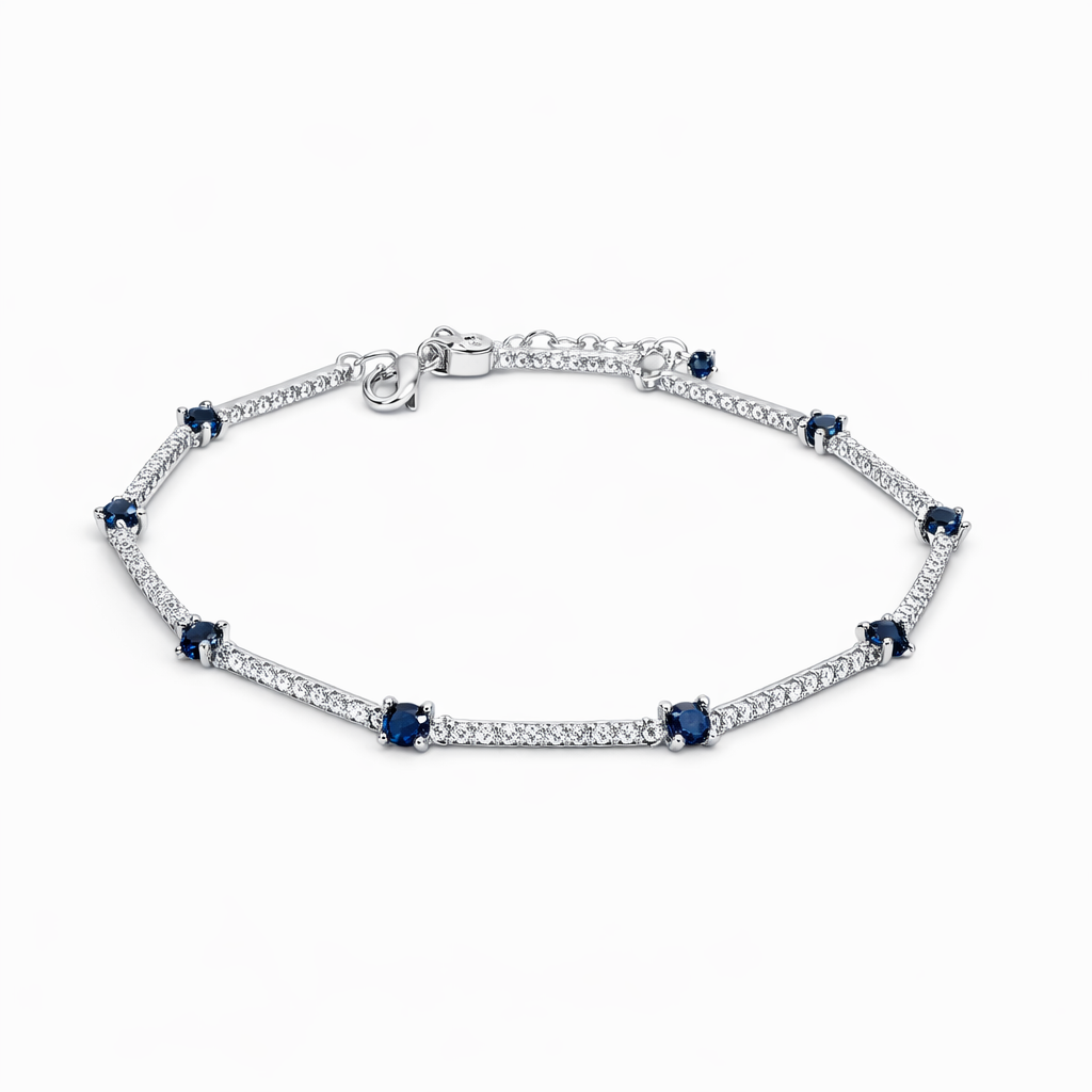 Dione Canada silver station bracelet with blue gemstone accents and crystal-set links
