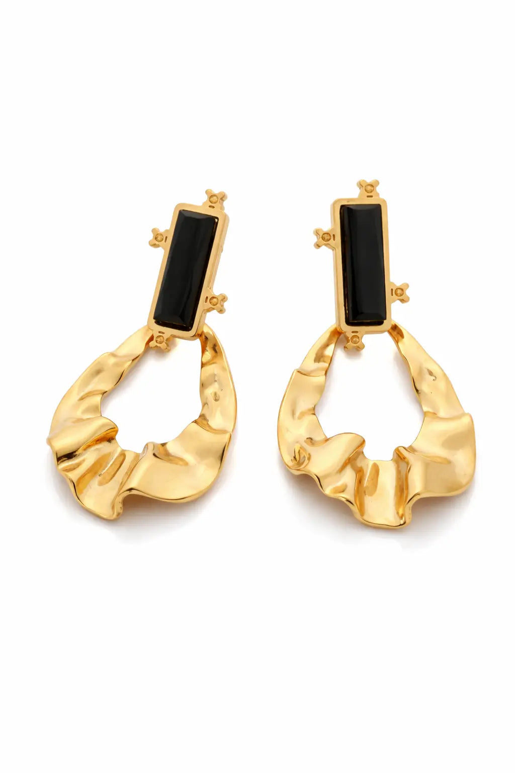 Gold hoop earrings with black stones on a white background