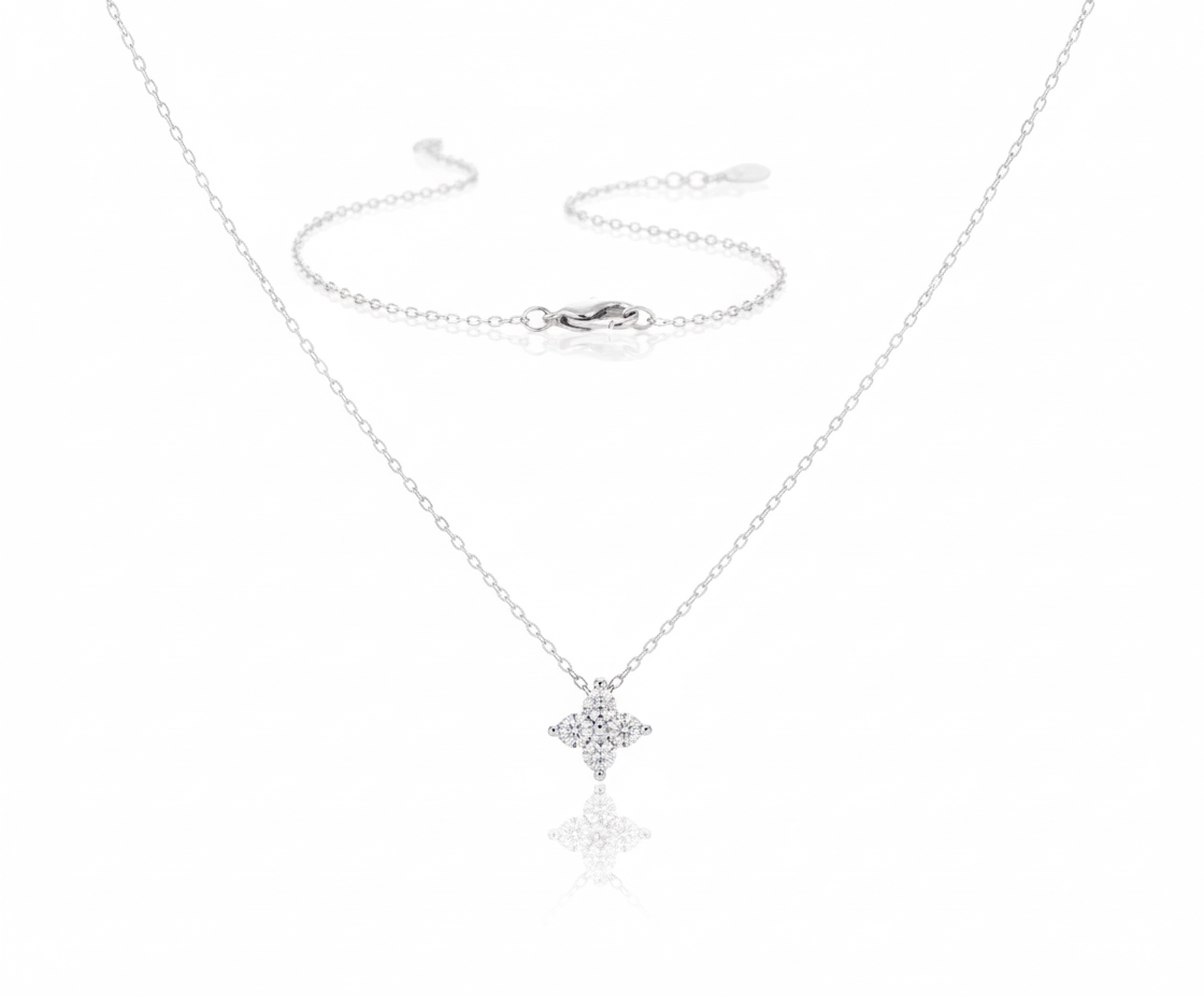 Lustra Necklace in 925 sterling silver with rhodium or 22K gold plating and a four-leaf clover pendant adorned with brilliant-cut zircon stones by Dione Canada