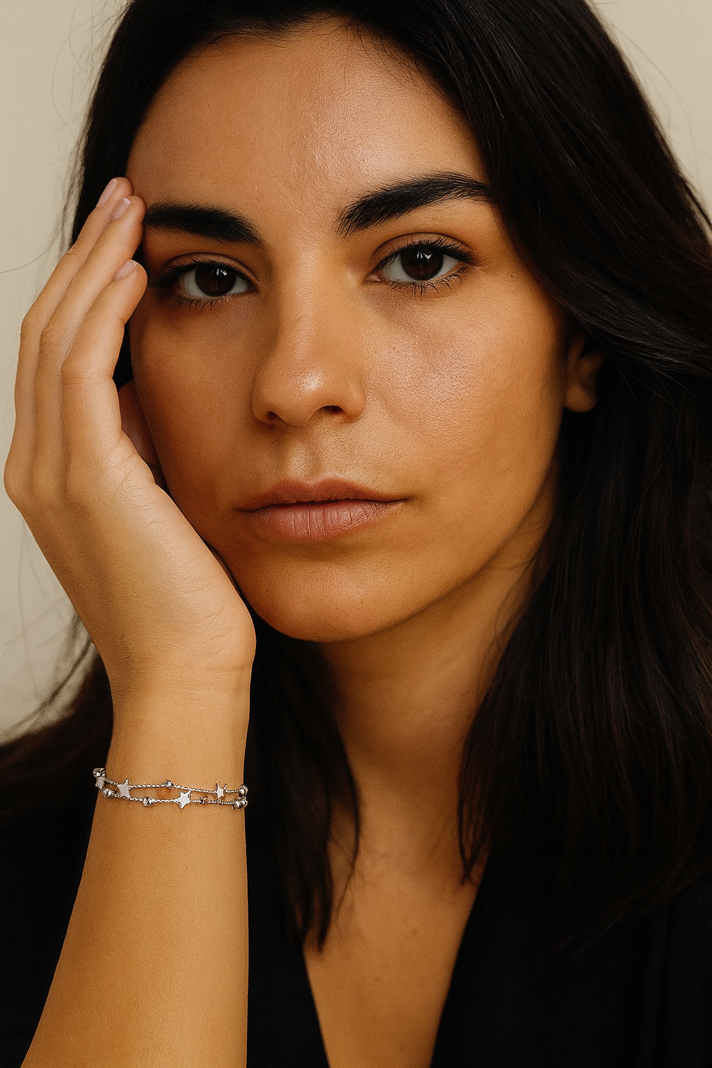 Model wearing Astra Bracelet – sterling silver double-chain bracelet with shimmering star bead design by Dione Canada