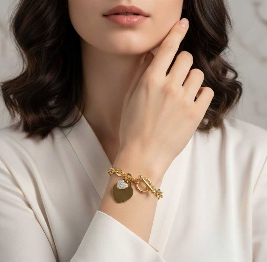 Model wearing Heart Link Toggle Bracelet – waterproof gold-plated stainless steel bracelet featuring elegant rhinestone heart by Dione Canada
