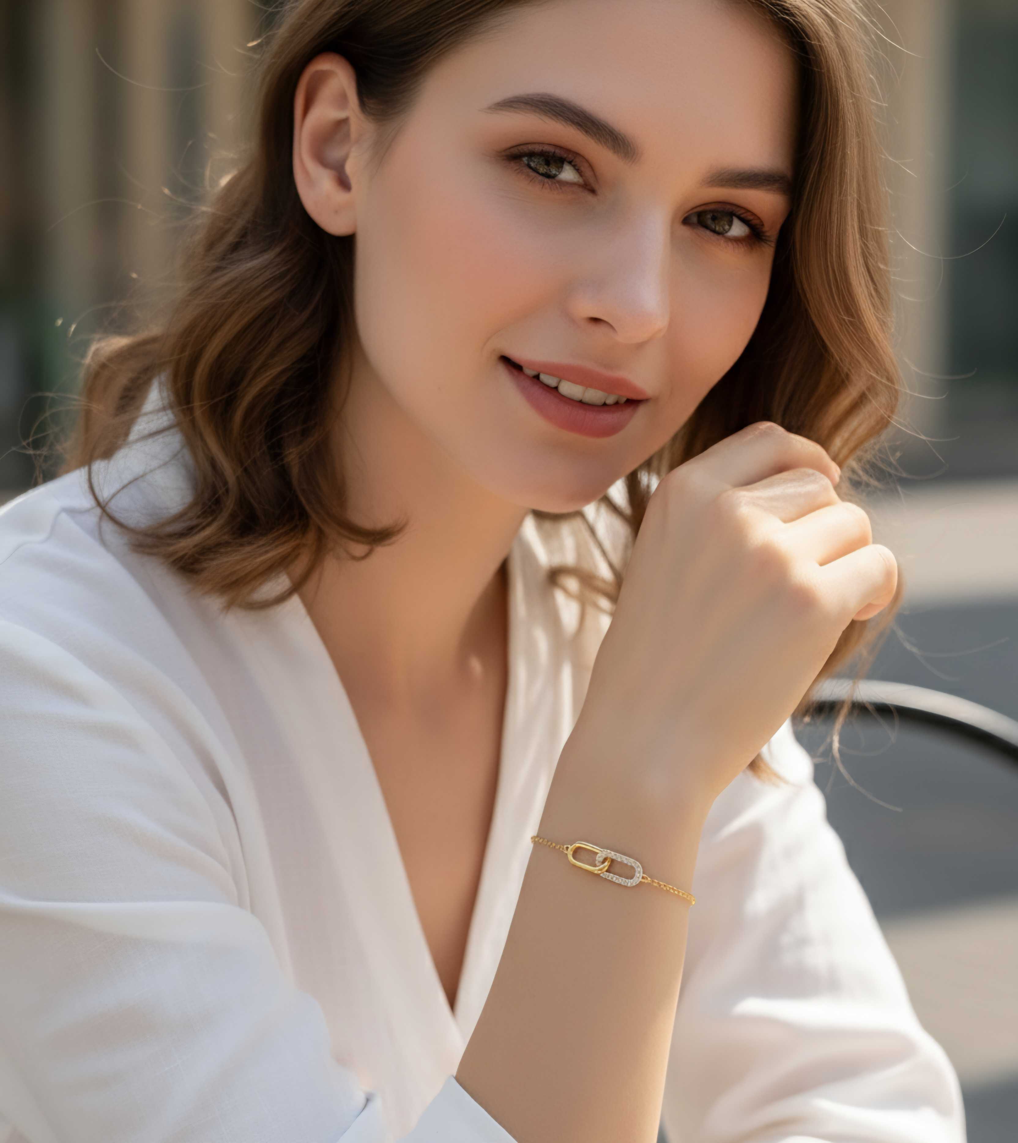 Model wearing Liora Bracelet – gold-plated sterling silver dual interlocking links with zircon detailing by Dione Canada