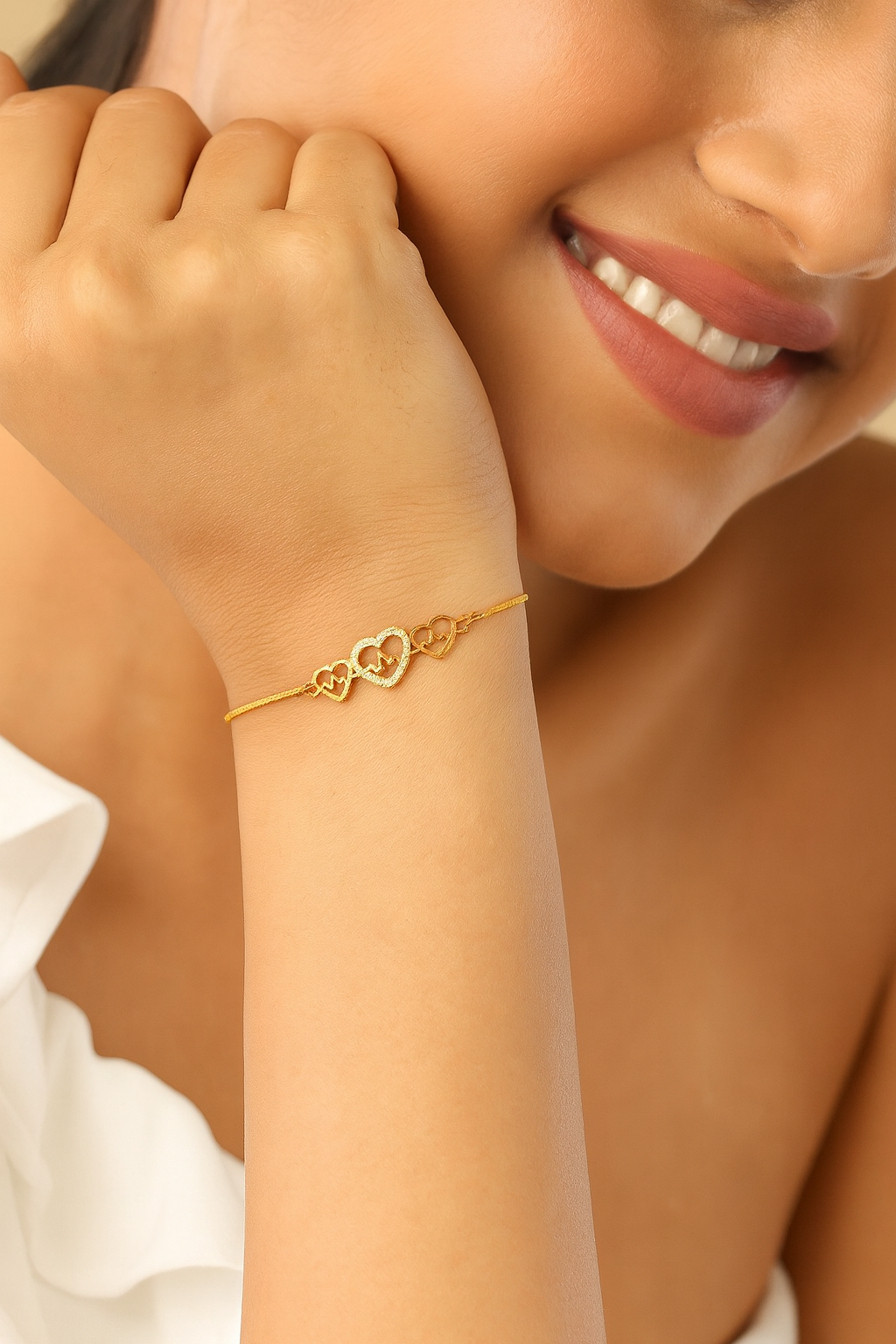 Model wearing Pulse of Love Bracelet – gold-plated copper bracelet with heartbeat and heart design adorned with zircon stones by Dione Canada