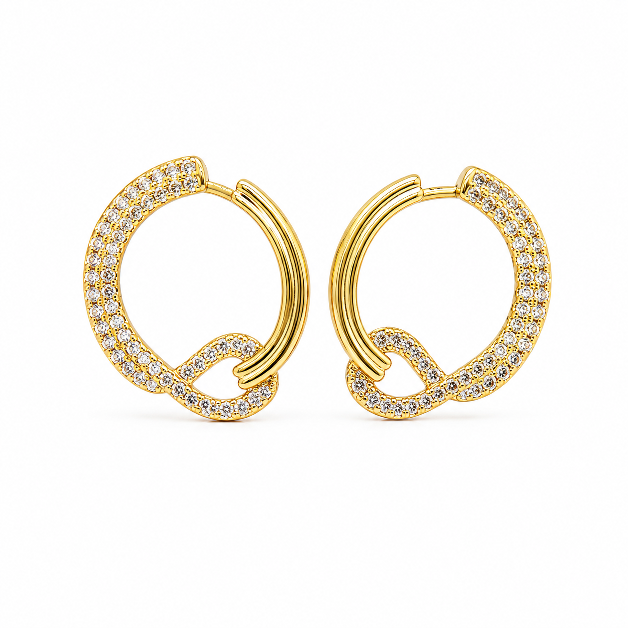 A pair of gold hoop earrings with pavé-set clear stones and a twisted knot detail, shown on a plain white background.