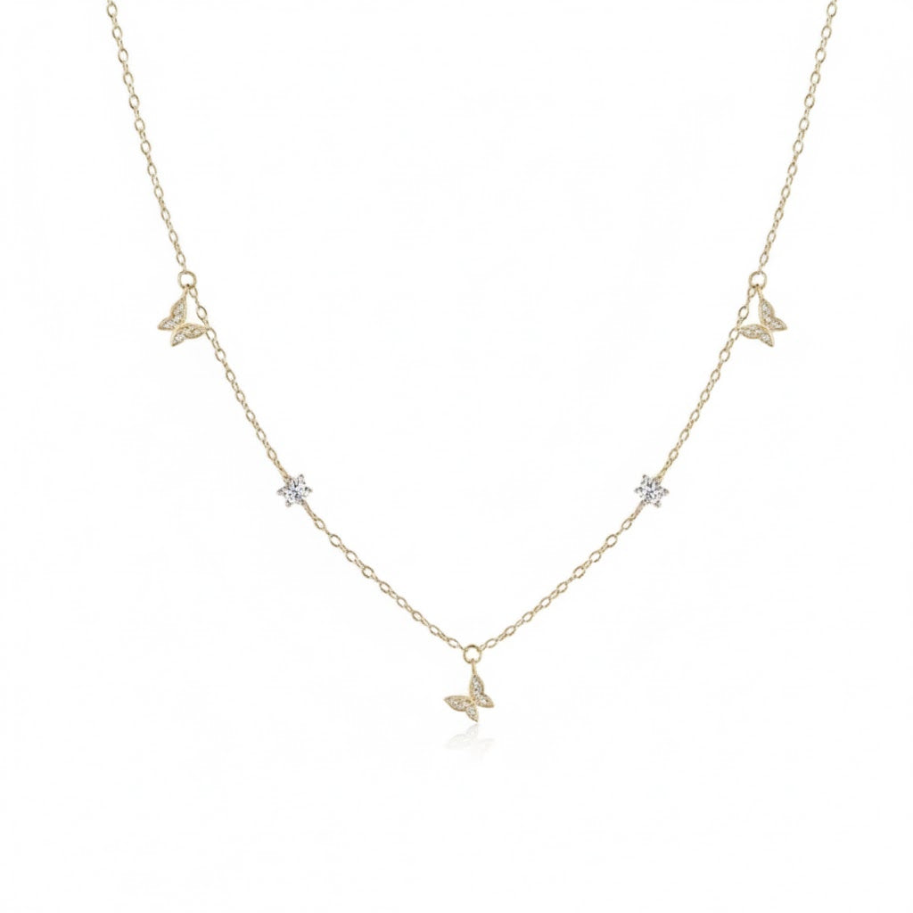 Papillon Necklace in 925 sterling silver with gold plating, adorned with butterfly and star charms inlaid with zircon stones by Dione Canada