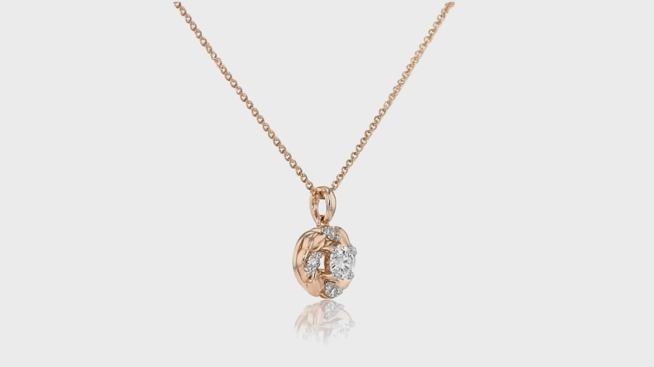 Rose gold pendant necklace by Dione Canada featuring a round brilliant crystal set in an elegant sculpted design, luxury studio close-up.