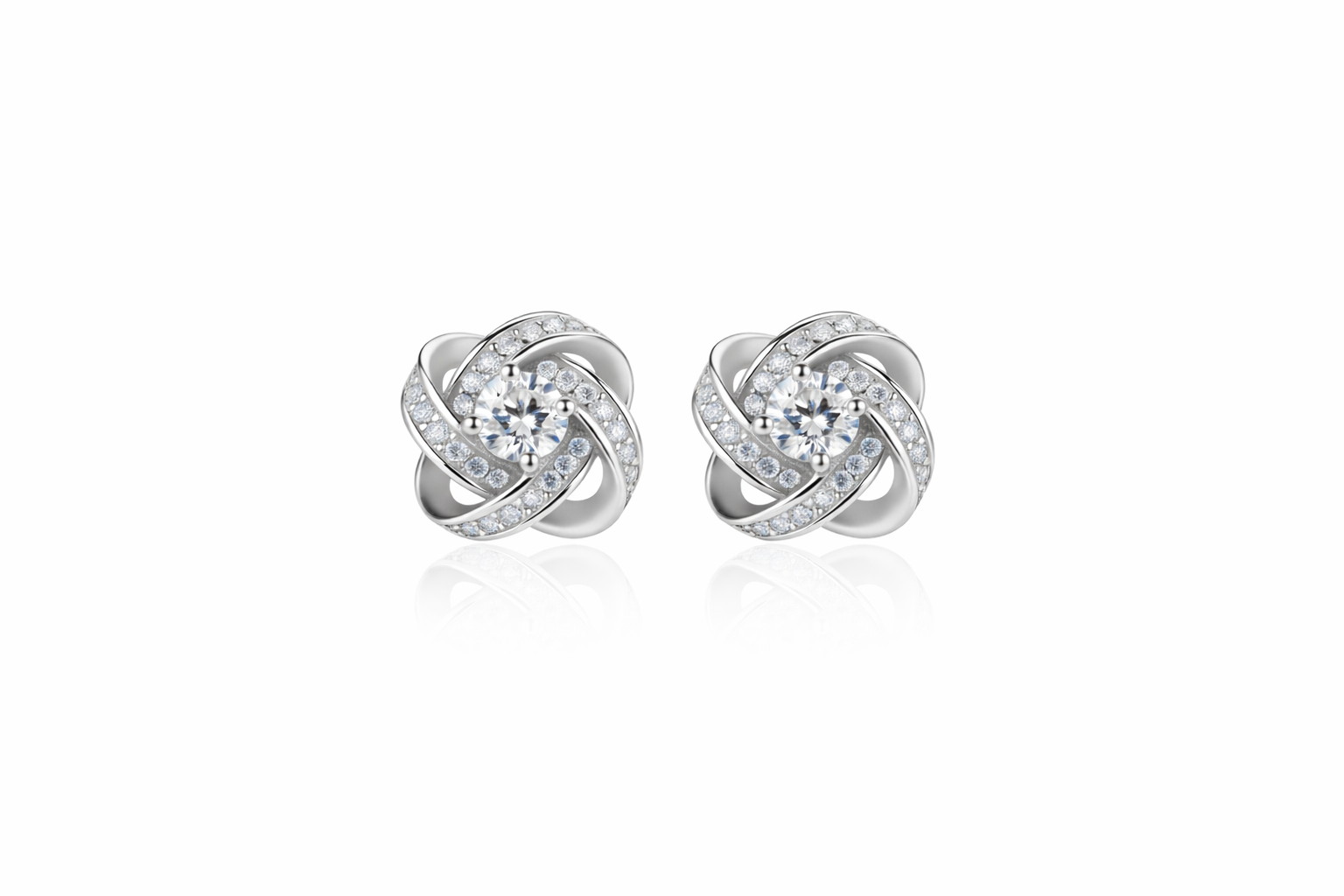 Silver diamond knot stud earrings with round center stones and pavé detailing.