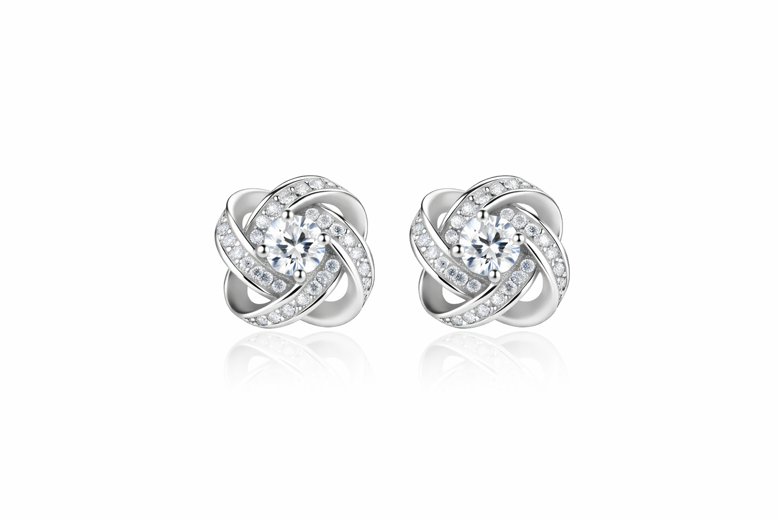 Pair of silver earrings with interlocking design on a white background