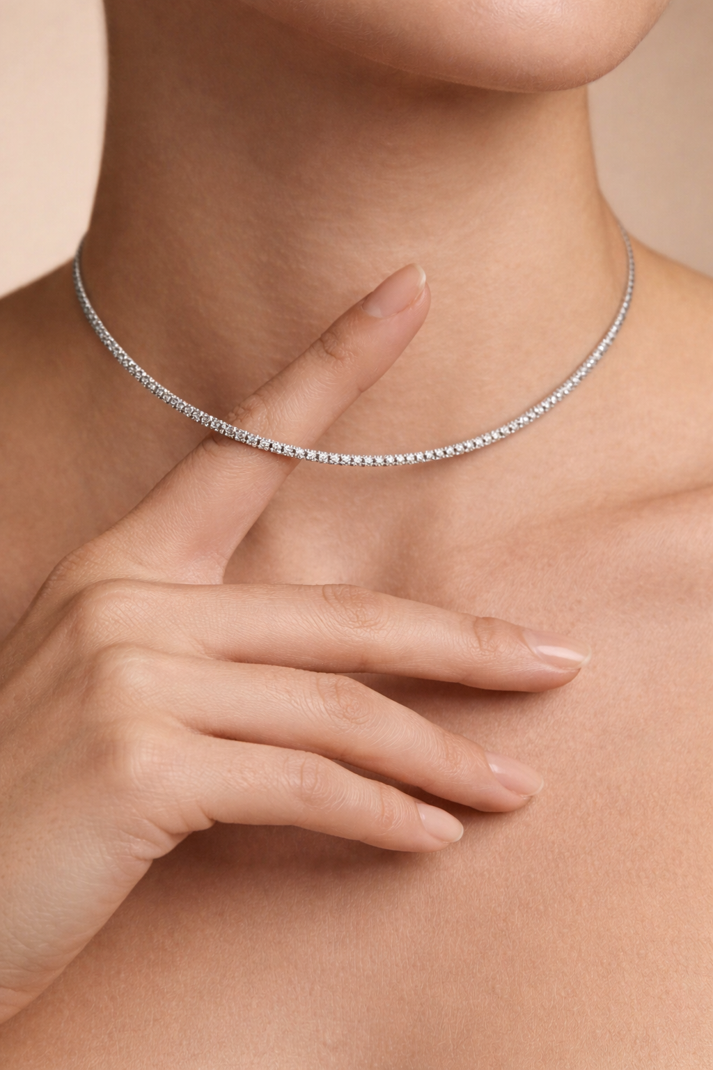 Woman wearing a silver tennis choker necklace with cubic zirconia stones in a minimal elegant style