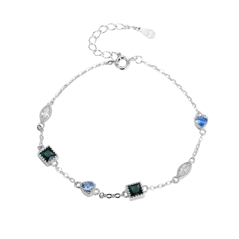 Trinity Gem Bracelet in 925 sterling silver with platinum plating and geometric gemstones including green squares and blue teardrop by Dione Canada