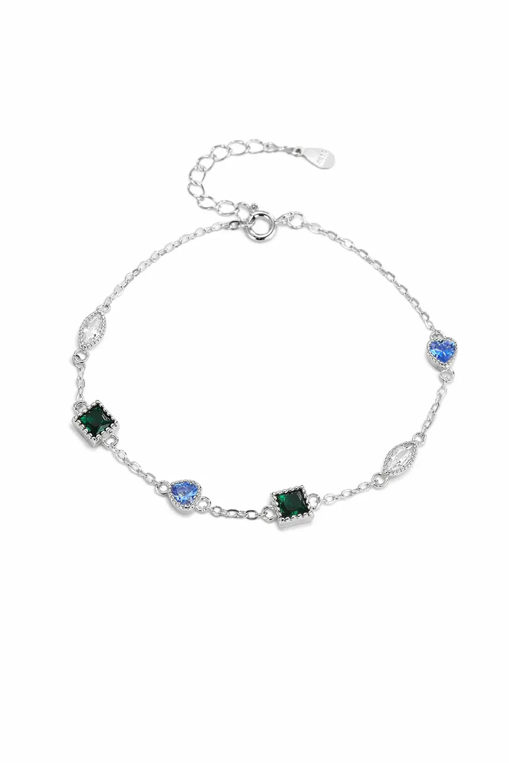 Silver bracelet with green and blue gemstones on a white background