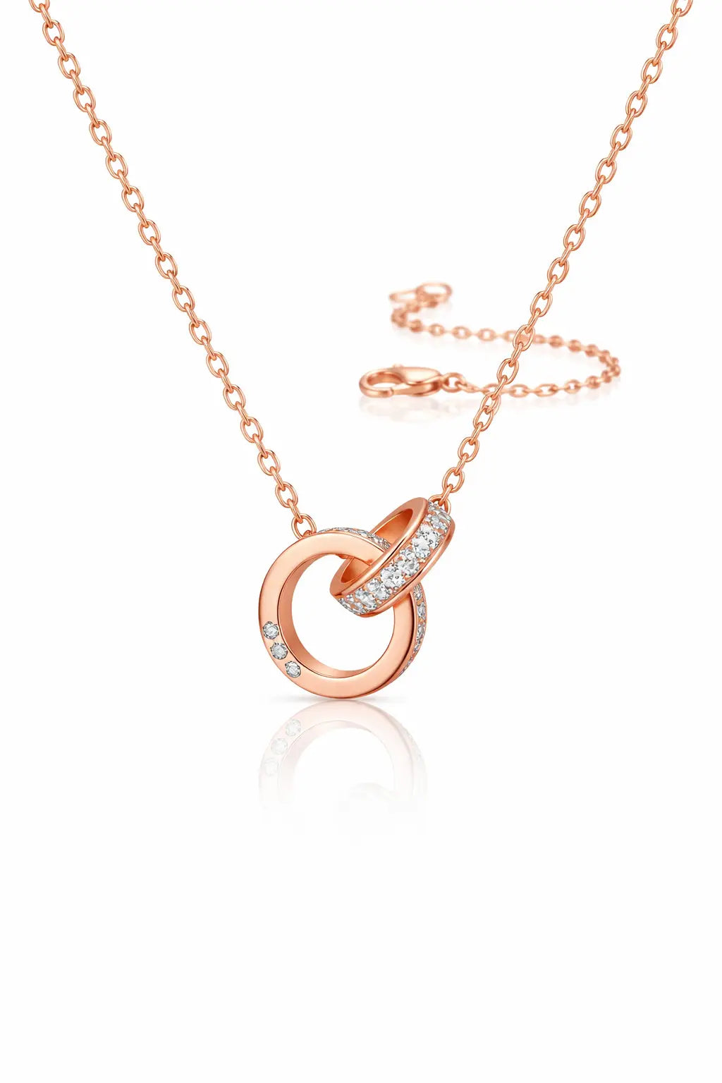 Rose gold necklace with interlocking rings on a white background